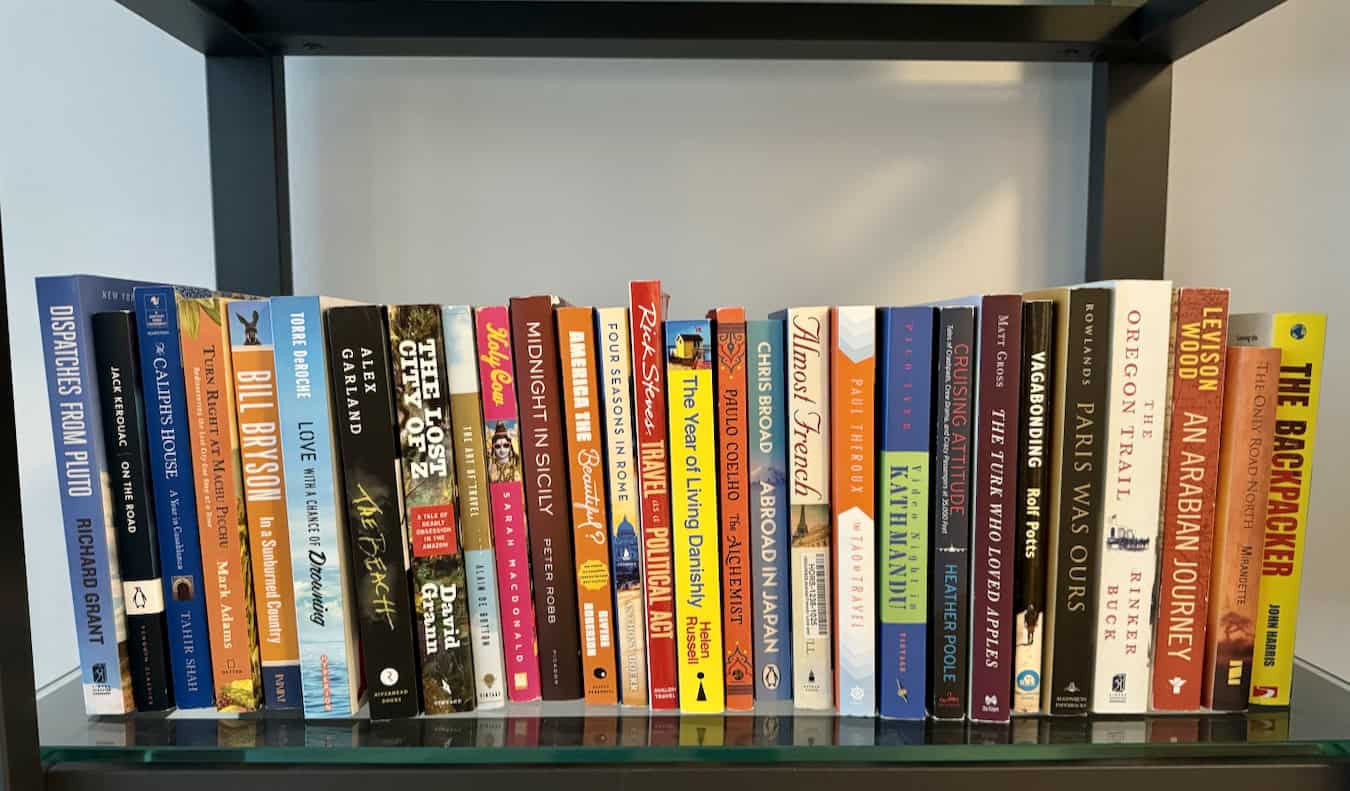 A bunch of travel books on Nomadic Matt's bookshelf