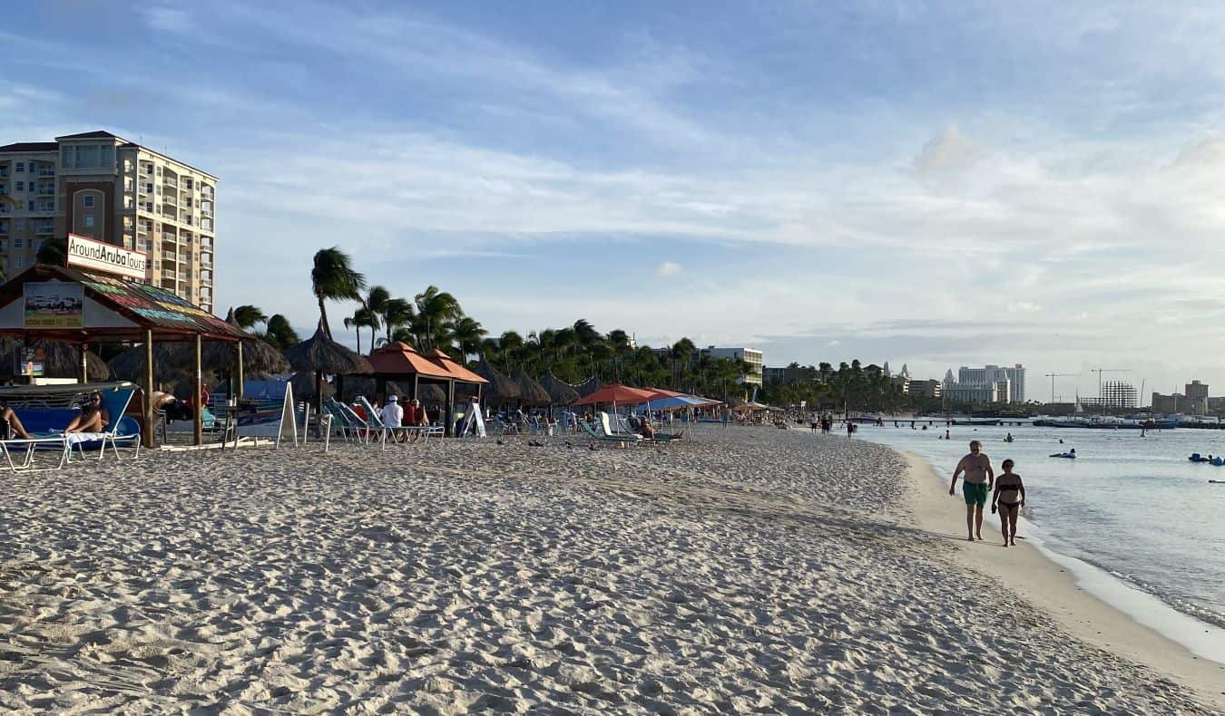 A hotel and beach chairs on the beach in Aruba