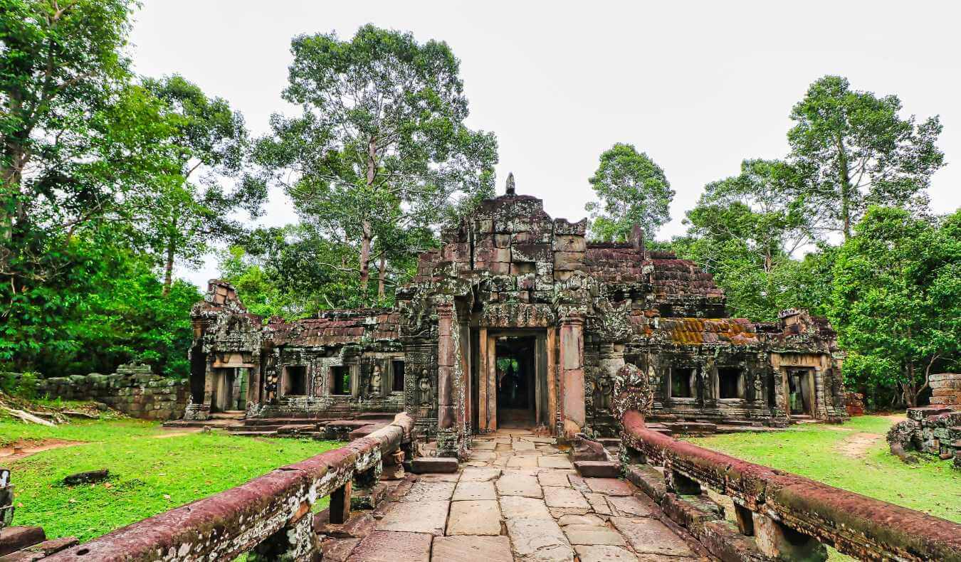 Stone walkway leading up to the ruins of Banteay Kdei, a 13th-century monastic Buddhist temple at Siem Reap, Cambodia, Asia