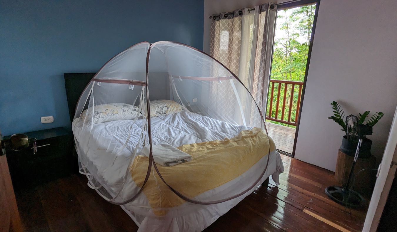 Mosquito net over a bed at a homestay in Costa Rica