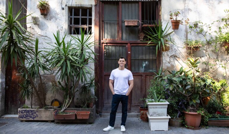 Nomadic Matt standing in front of a wall covered in plants in Barcelona, Spain