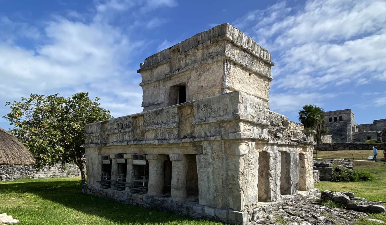 The historic ruins of Tulum, Mexico on a bright and sunny day with a blue sky above