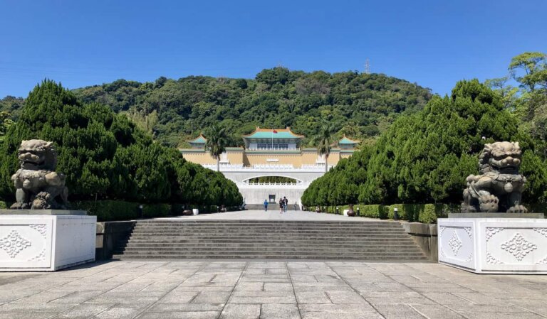 The beautiful National Palace in Taipei, Taiwan on a bright and sunny day surrounded by lush trees