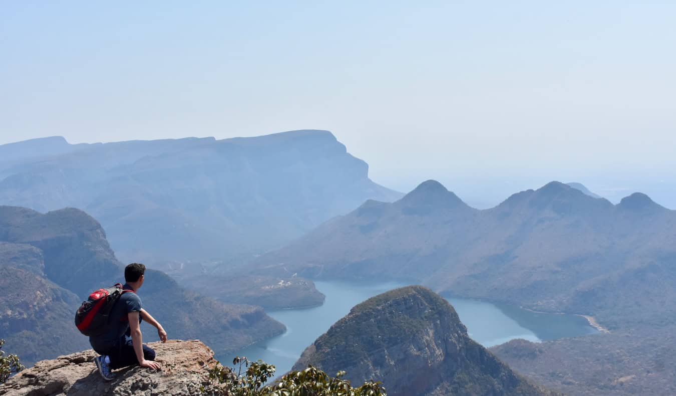 Nomadic Matt hiking in a massive canyon in South Africa